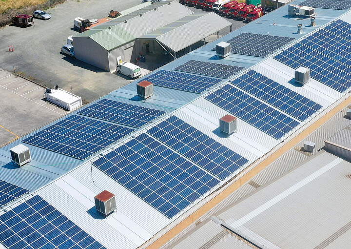 Aerial view of rooftop solar panels on a commercial building